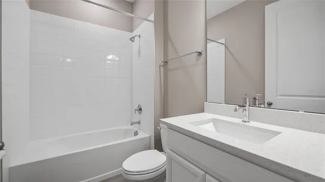 a bathroom with a sink a toilet and a bathtub
