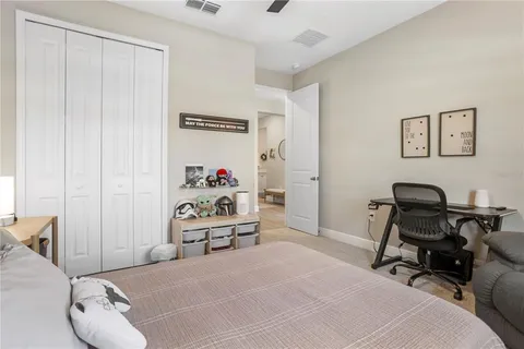 a bedroom with a workspace