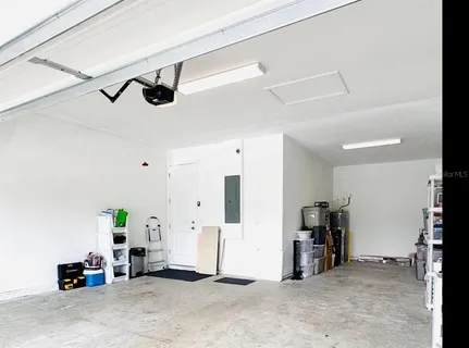a living room with furniture a window and a table