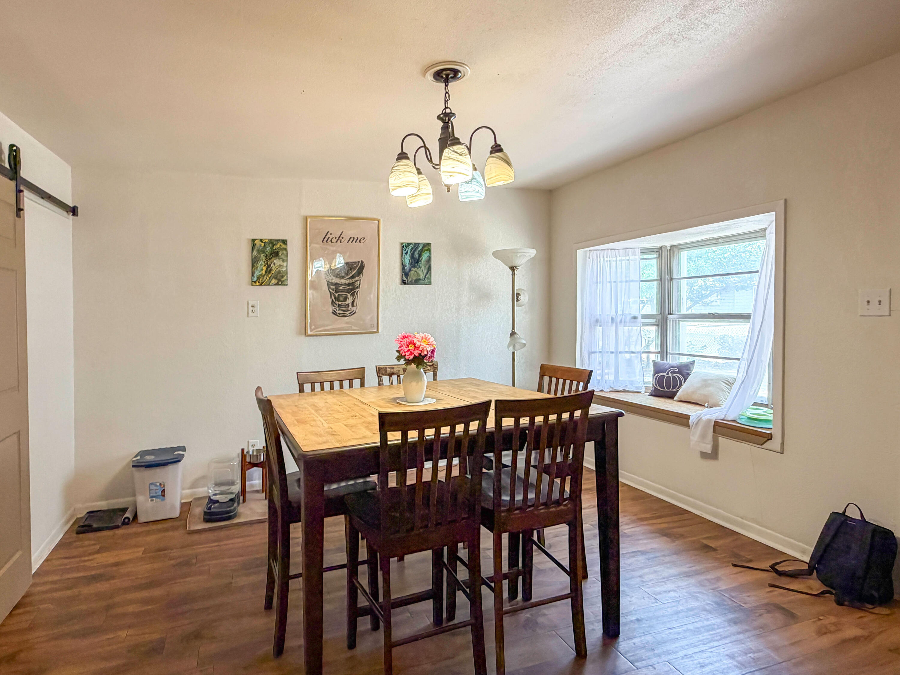 3221 Emory Street Lubbock, TX 79415 - Photo 4 of 15 a view of a dining room with furniture window and wooden floor