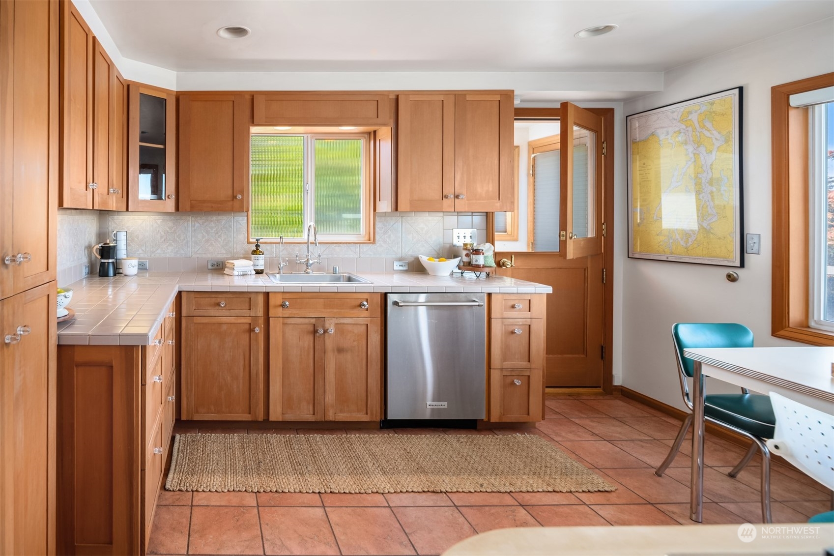 3711 55th Avenue Southwest Seattle, WA 98116 - Photo 13 of 33 a kitchen with a sink stove and cabinets