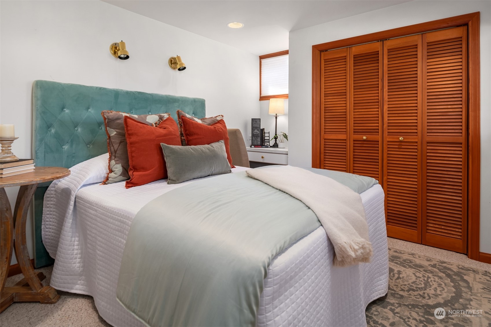 3711 55th Avenue Southwest Seattle, WA 98116 - Photo 25 of 33 a bedroom with a bed and a window
