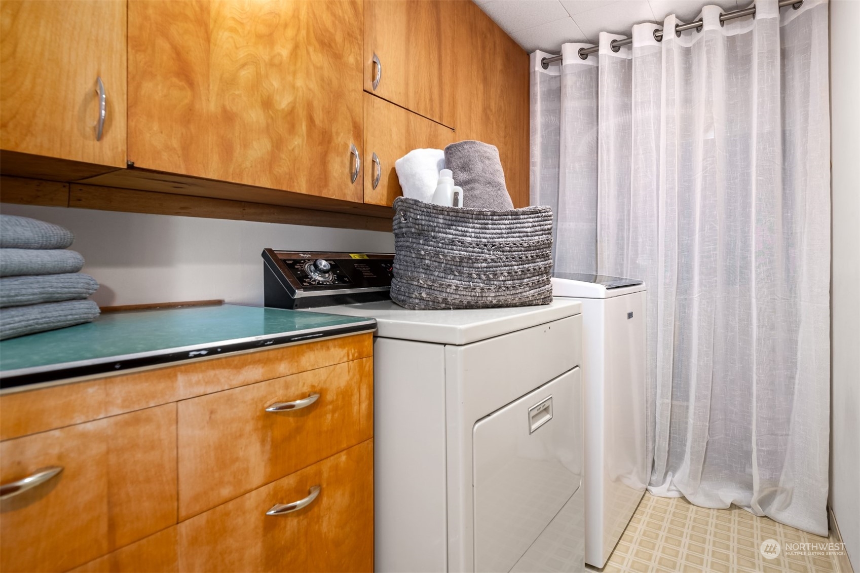 3711 55th Avenue Southwest Seattle, WA 98116 - Photo 26 of 33 a kitchen with stainless steel appliances granite countertop a sink a stove and a refrigerator