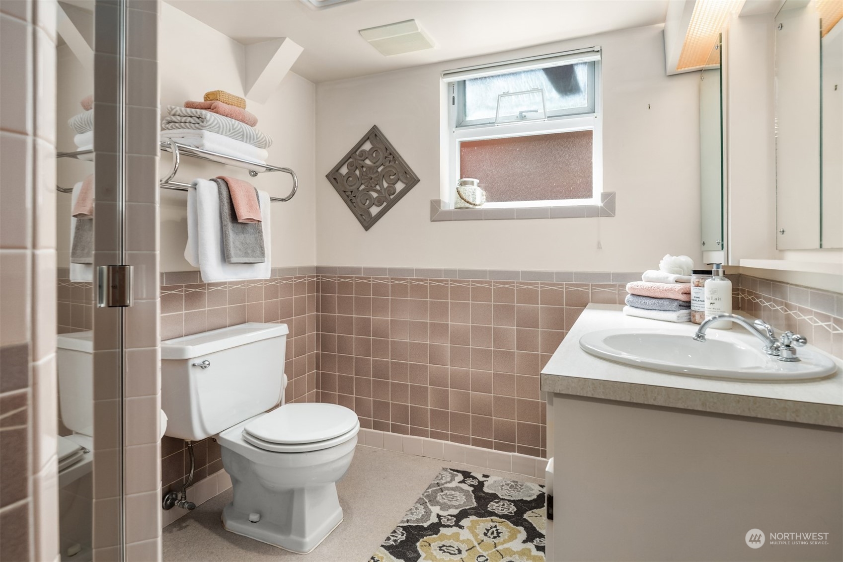 3711 55th Avenue Southwest Seattle, WA 98116 - Photo 27 of 33 a bathroom with a toilet sink and mirror