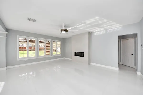 a kitchen with granite countertop a sink and a stove top oven