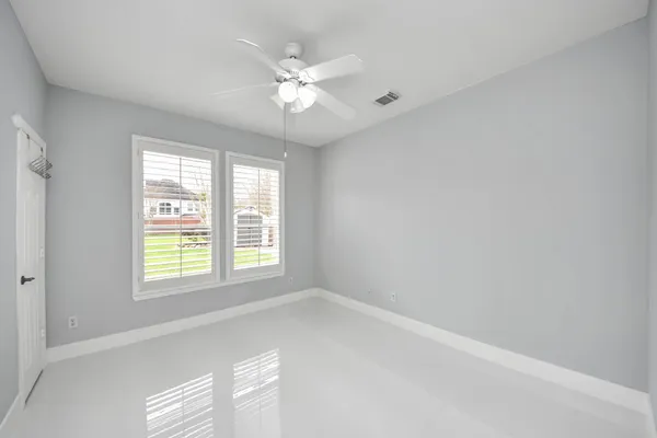 a bathroom with a sink a toilet a mirror and shower