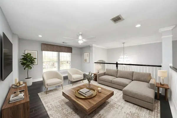 a bedroom with a large bed couch and a window