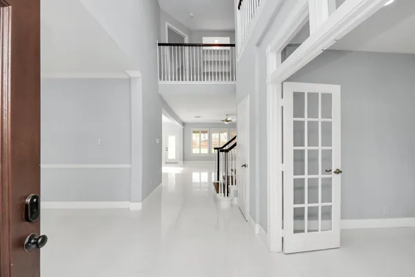 a view of entryway and hall with a front door