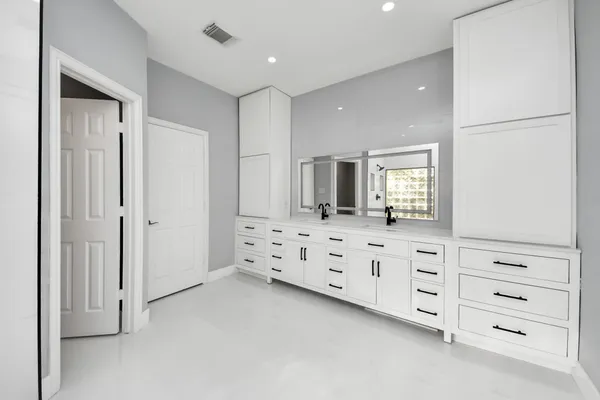 a view of a livingroom with a window and wooden floor