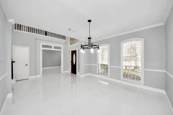 a dining room with furniture window and outside view