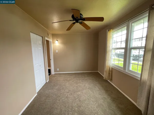 a view of an empty room with a window