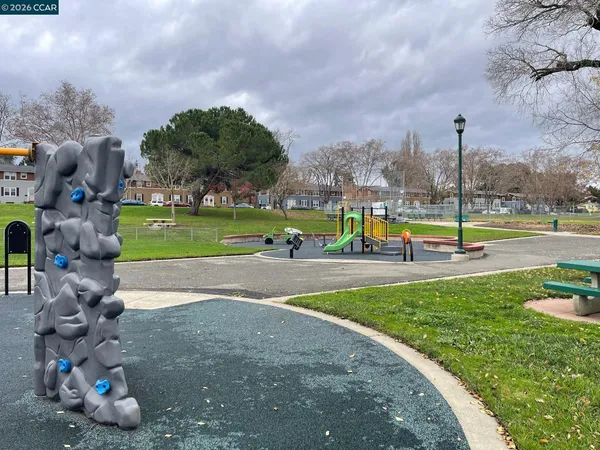 a view of a park with swings