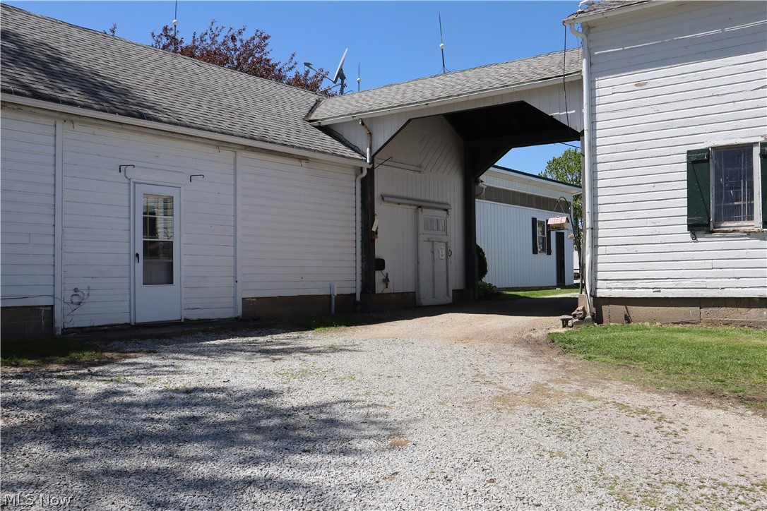 10286 Wilson Mills Road Chardon, OH 44024 - Photo 7 of 41 Archway to main barn, entrance to carriage house apartment, workshops and century barn