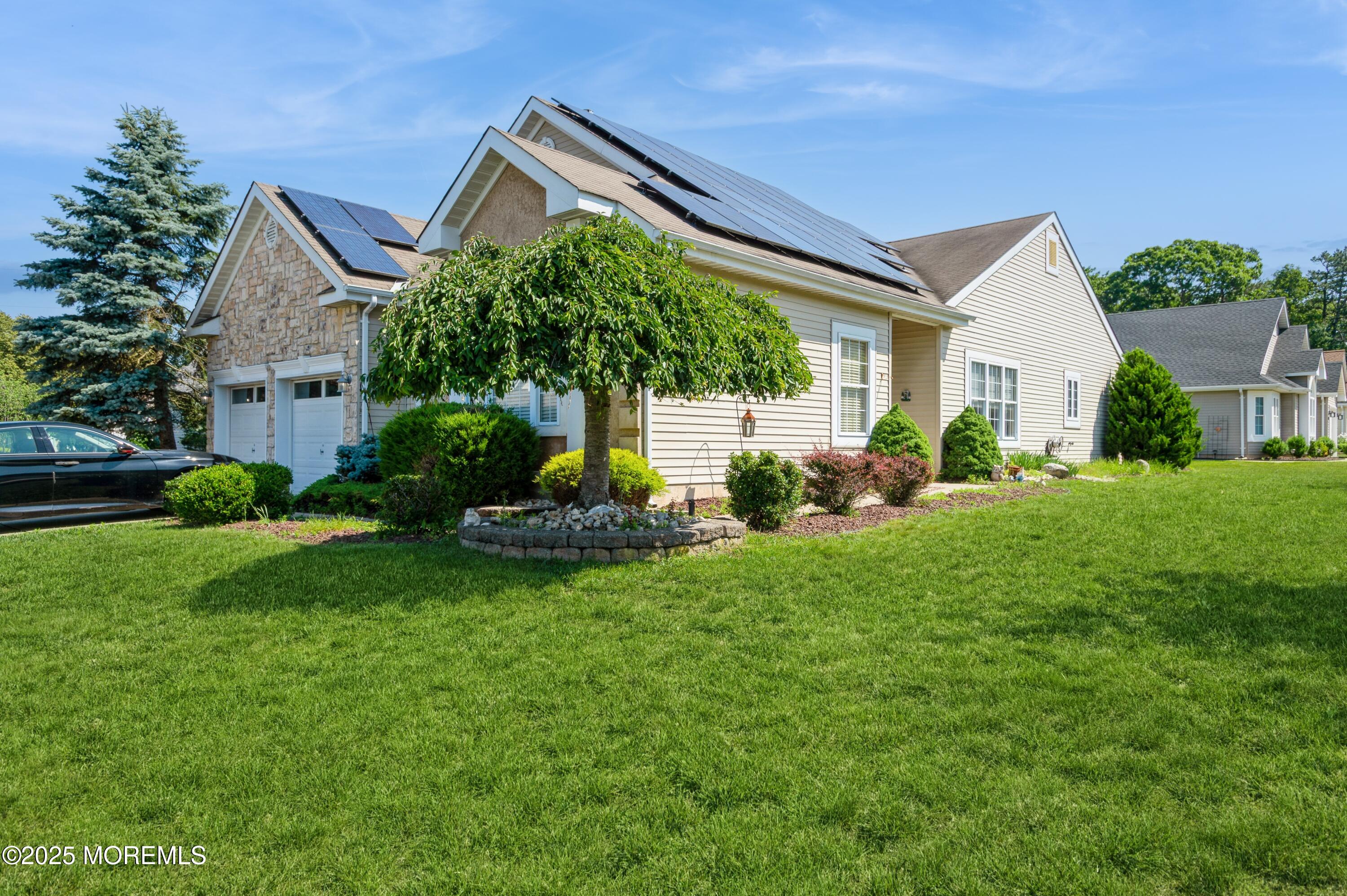 a front view of a house with garden