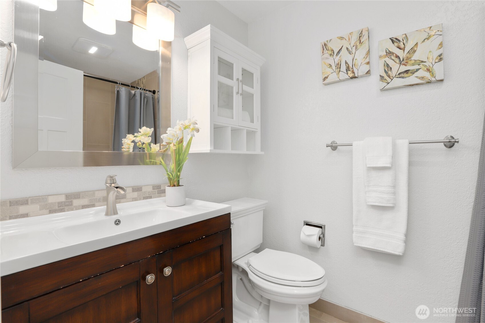1822 171st Place Southeast Bothell, WA 98012 - Photo 11 of 36 a bathroom with a sink a toilet and a mirror