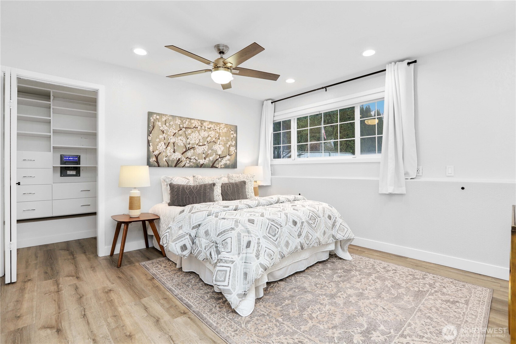 1822 171st Place Southeast Bothell, WA 98012 - Photo 15 of 36 a bed sitting in a bedroom next to a window