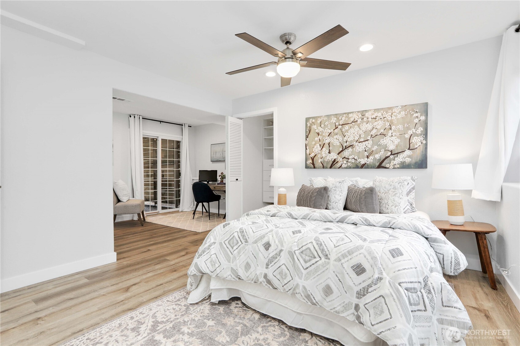 1822 171st Place Southeast Bothell, WA 98012 - Photo 16 of 36 a bedroom with a bed and a chandelier