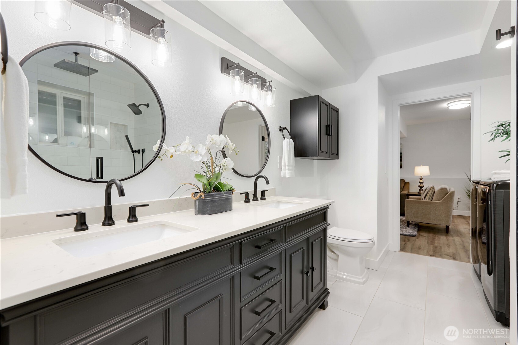 1822 171st Place Southeast Bothell, WA 98012 - Photo 18 of 36 a en suite bathroom with double vanity sinks and a mirror