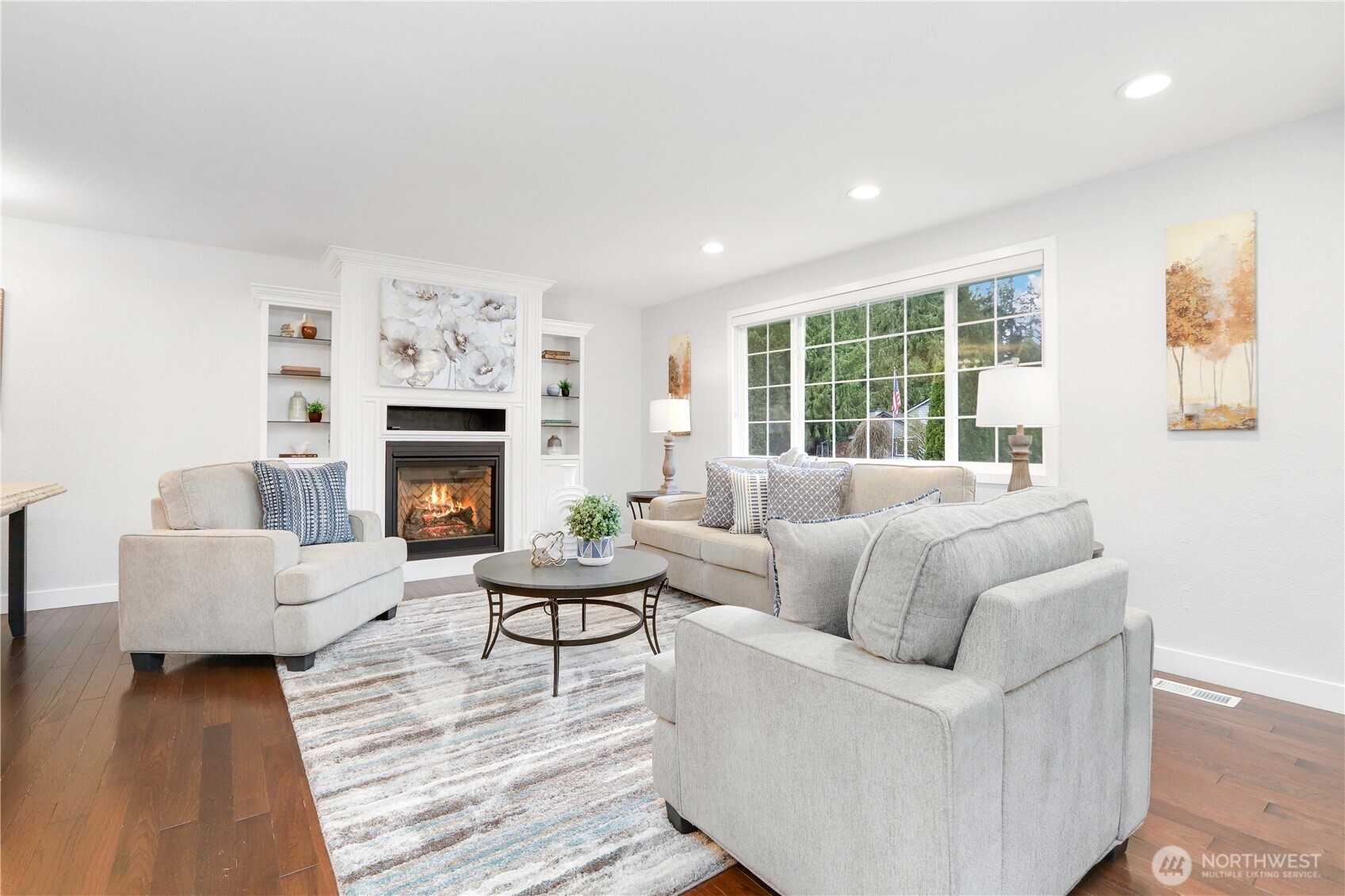 1822 171st Place Southeast Bothell, WA 98012 - Photo 2 of 36 a living room with furniture large window and a fireplace
