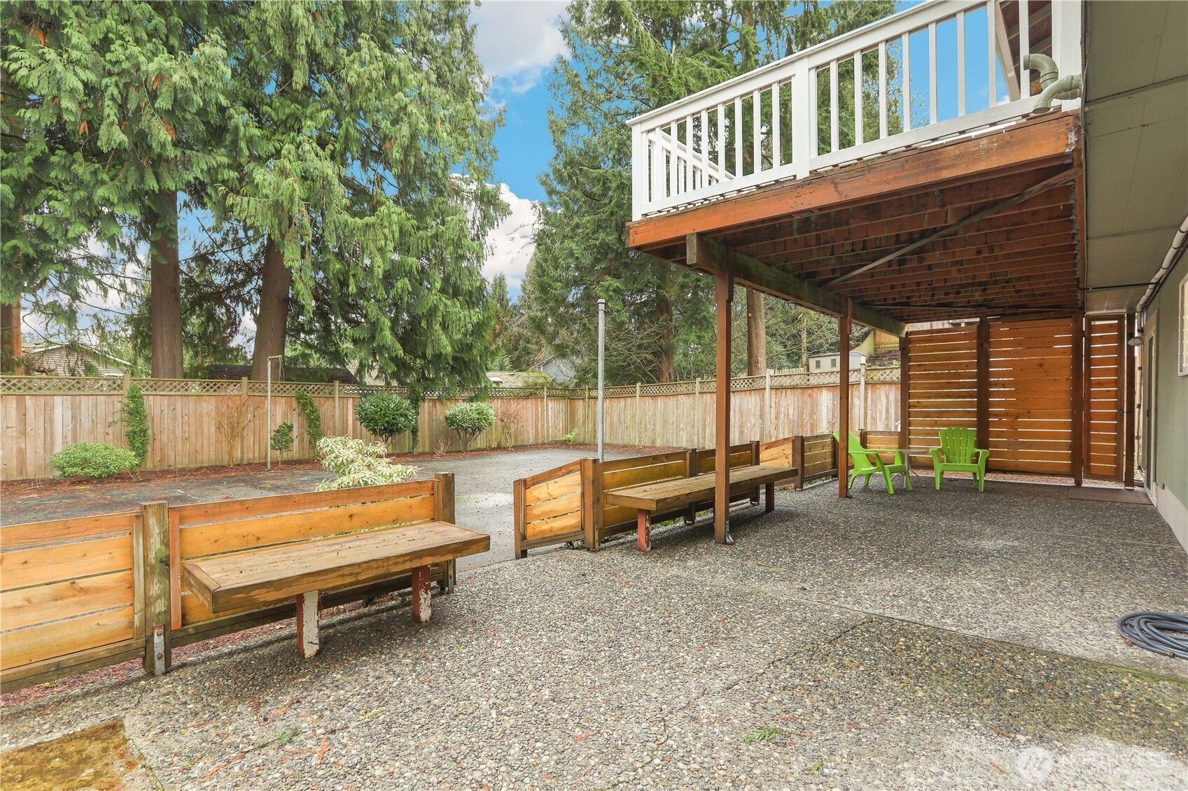 1822 171st Place Southeast Bothell, WA 98012 - Photo 22 of 36 a backyard of a house with barbeque oven table and chairs