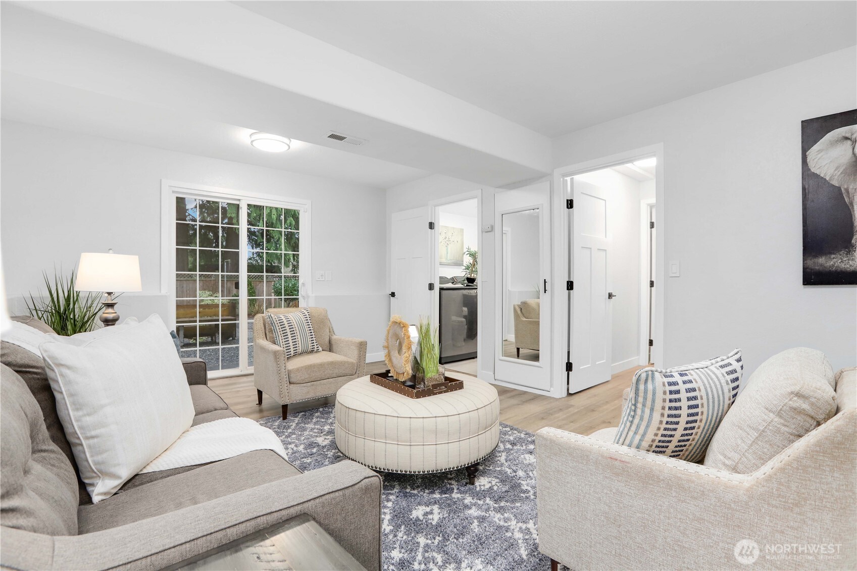 1822 171st Place Southeast Bothell, WA 98012 - Photo 25 of 36 a living room with furniture and a large window