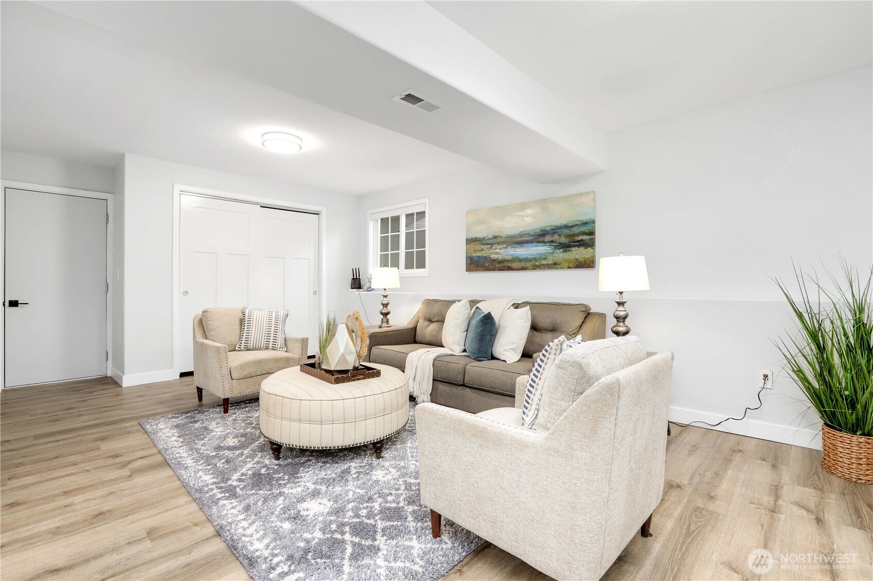 1822 171st Place Southeast Bothell, WA 98012 - Photo 26 of 36 a living room with furniture and a potted plant