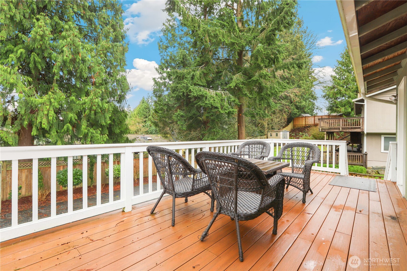 1822 171st Place Southeast Bothell, WA 98012 - Photo 28 of 36 a view of a balcony with chairs and wooden floor