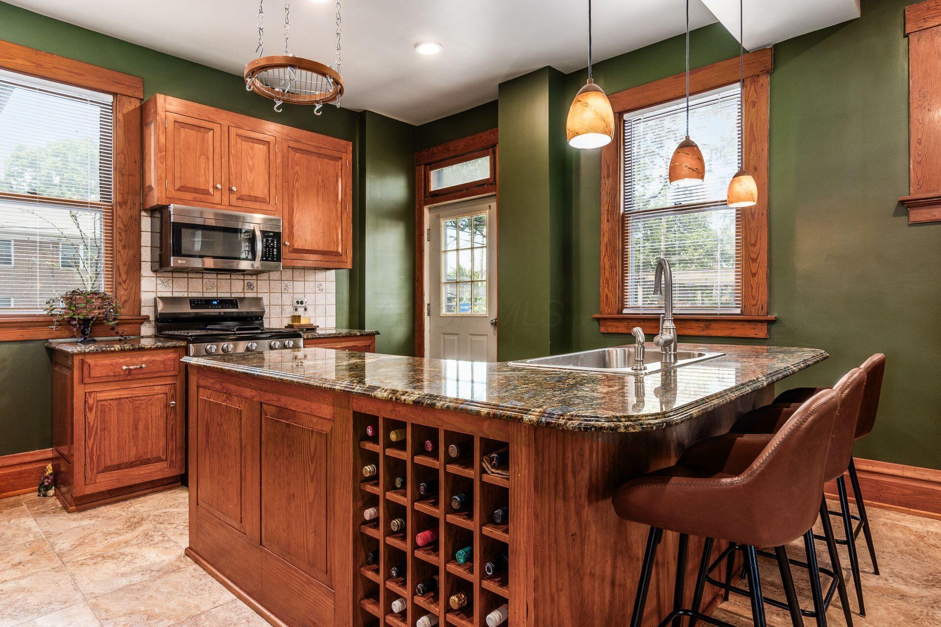 1412 Bryden Road Columbus, OH 43205 - Photo 33 of 87 The large island forms the centerpiece for the kitchen