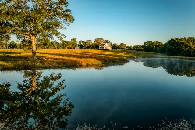 a view of lake with green space