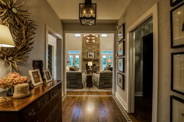 a view of a entryway with furniture and wooden floor