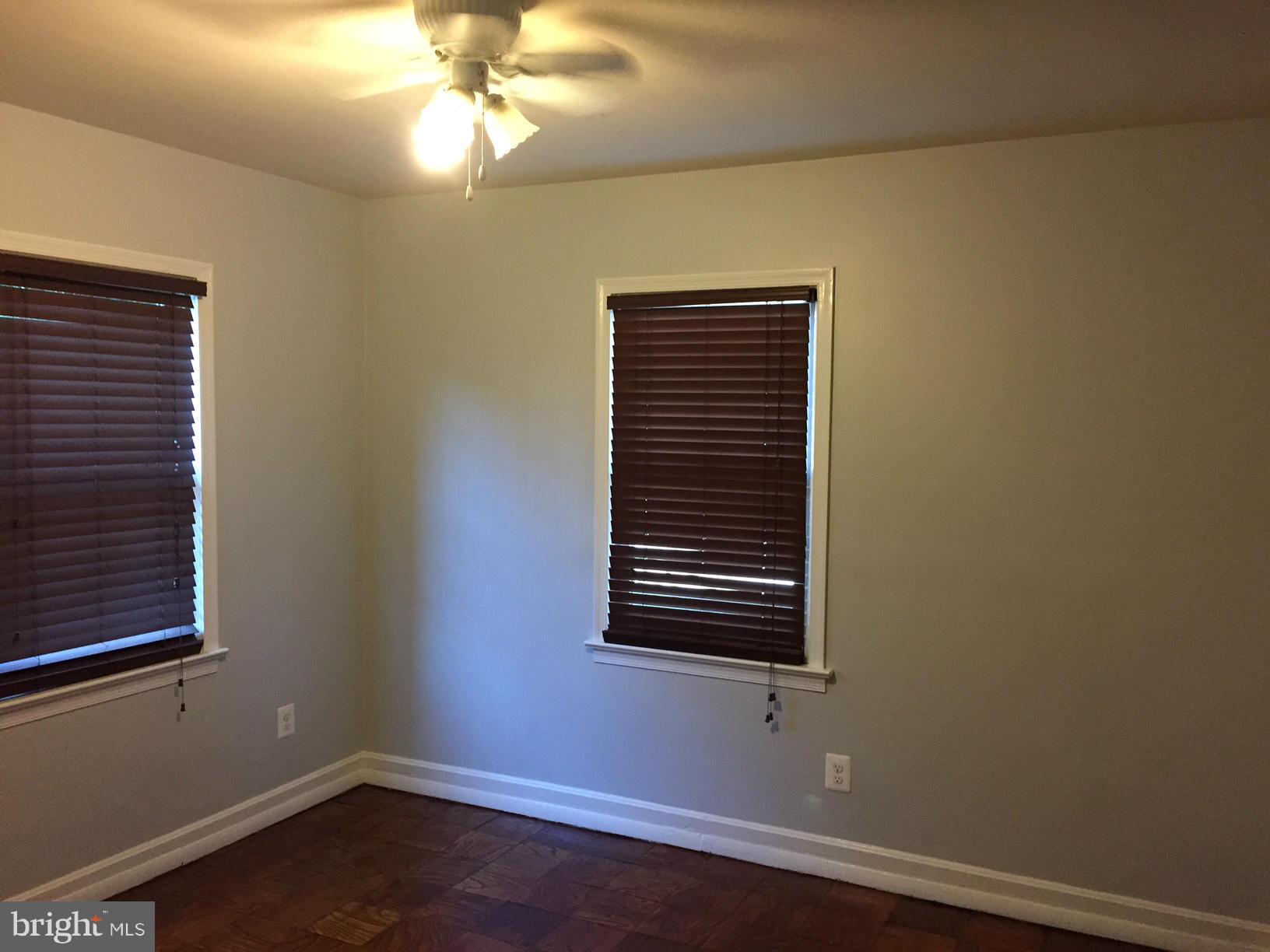 301 East Braddock Road Alexandria, VA 22301 - Photo 14 of 29 a view of empty room with wooden floor and fan
