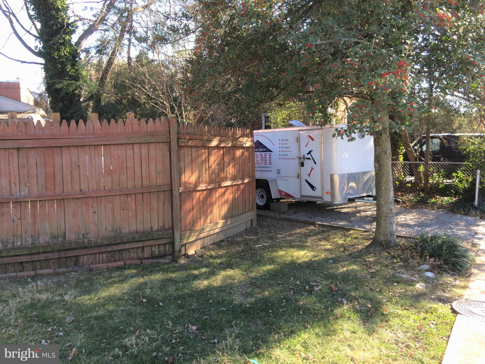301 East Braddock Road Alexandria, VA 22301 - Photo 23 of 29 a view of a backyard with wooden fence and large tree