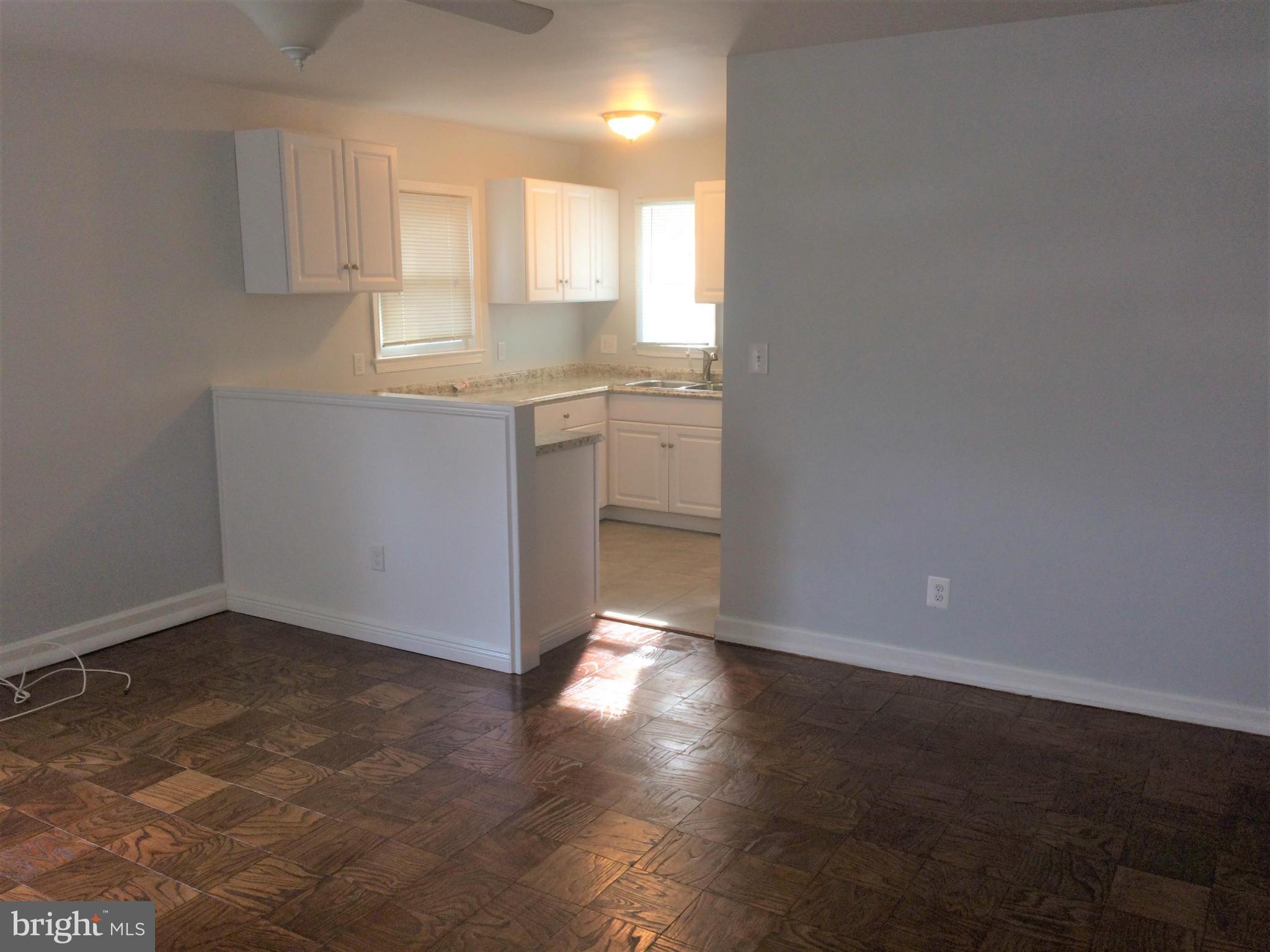 301 East Braddock Road Alexandria, VA 22301 - Photo 4 of 29 a view of a kitchen with a sink cabinets and a window