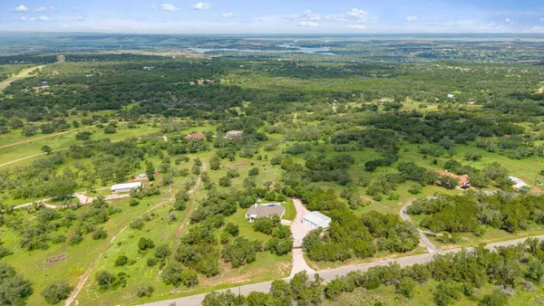 a view of a field with an ocean view