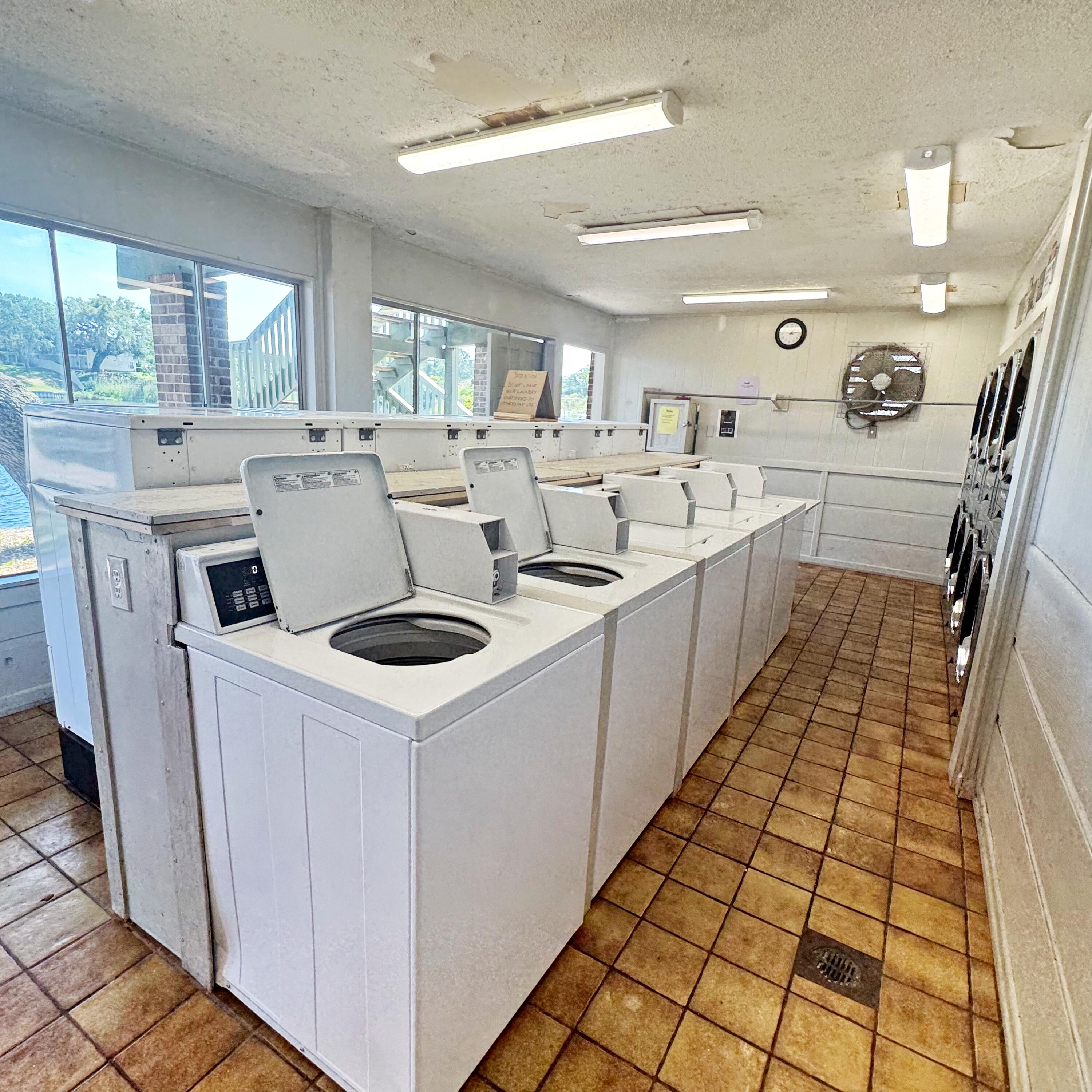 210 Pelham Road, Unit 215B Fort Walton Beach, FL 32547 - Photo 11 of 23 a kitchen with a sink a stove top oven and a window