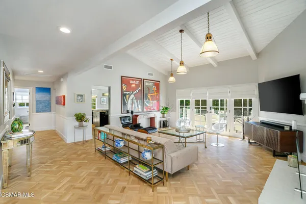 a living room with fireplace furniture and a flat screen tv