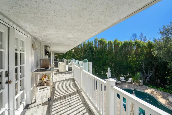 a view of balcony with furniture