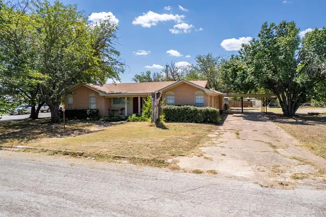 a house with trees in front of it