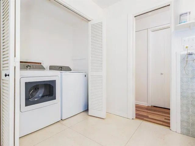 a utility room with dryer and washer