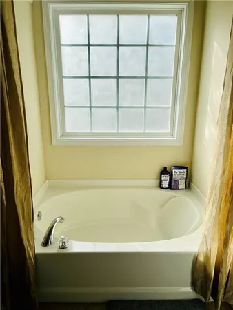 a bathroom with bathtub