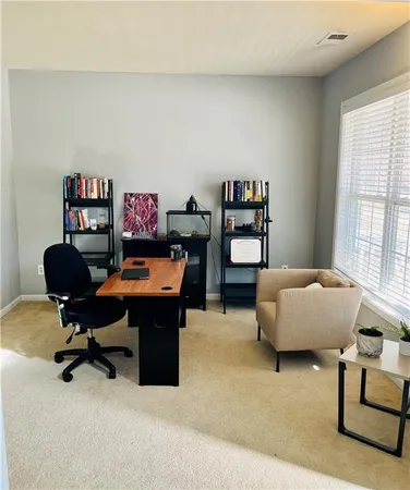 a bedroom with a workspace
