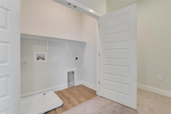 a kitchen with white cabinets a sink and appliances