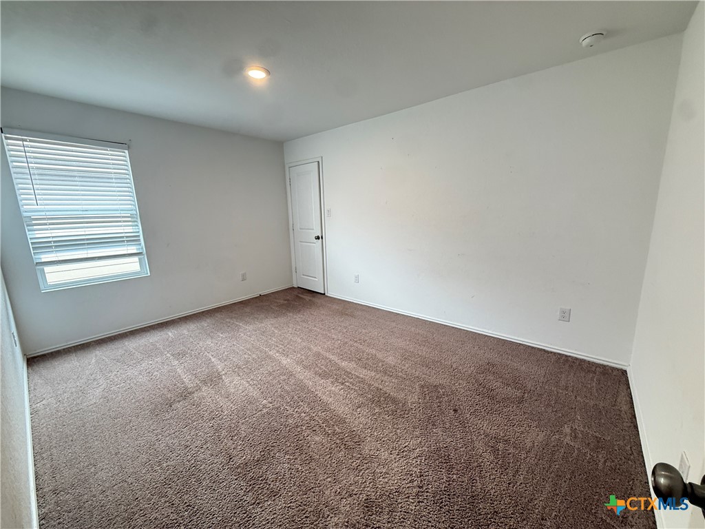 5863 Coahulia Ridge Seguin, TX 78155 - Photo 8 of 15 a view of an empty room and a window