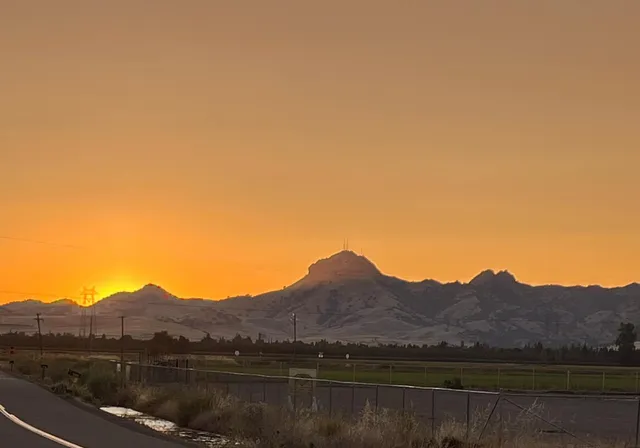 a view of a house with backyard porch and sitting area