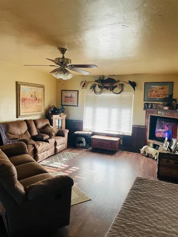a bathroom with a granite countertop toilet sink and mirror