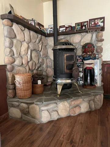 a bathroom with a granite countertop shower and a toilet