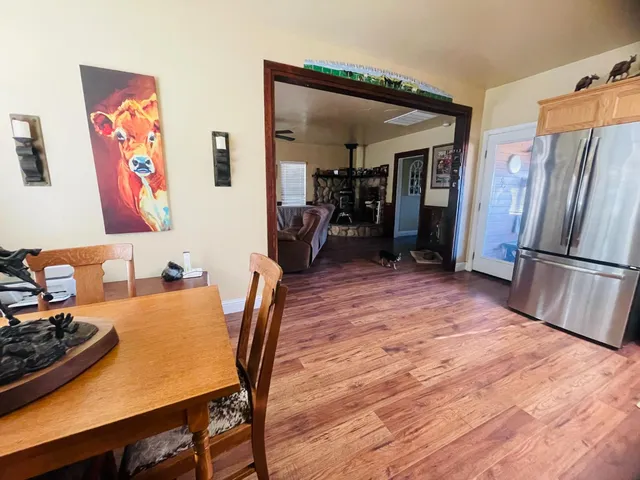 a backyard of a house with table and chairs