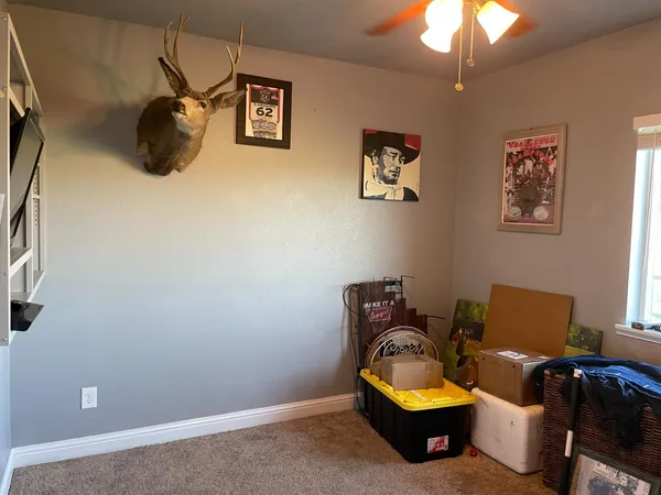 a view of a porch with furniture and yard