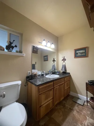 a view of a backyard with furniture and garden view