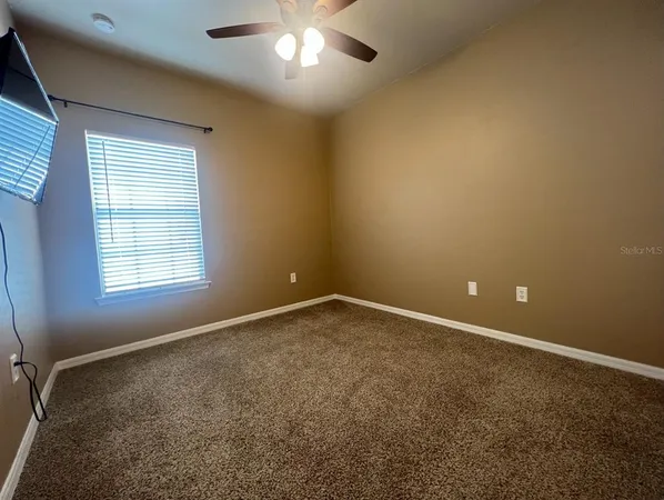 an empty room with a empty space and a window